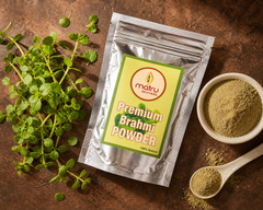  Fresh Brahmi Bacopa monnieri leaves and powder in a bowl beside Matru Ayurveda stand-up pouch — pure ayurvedic herb for hair growth