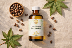  Raw castor seeds and castor plant beside Matru Ayurveda cold pressed castor oil bottle — pure natural source