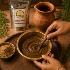  Shikakai powder being mixed with warm water into a paste in a bowl — natural hair wash recipe for ayurvedic hair cleanser